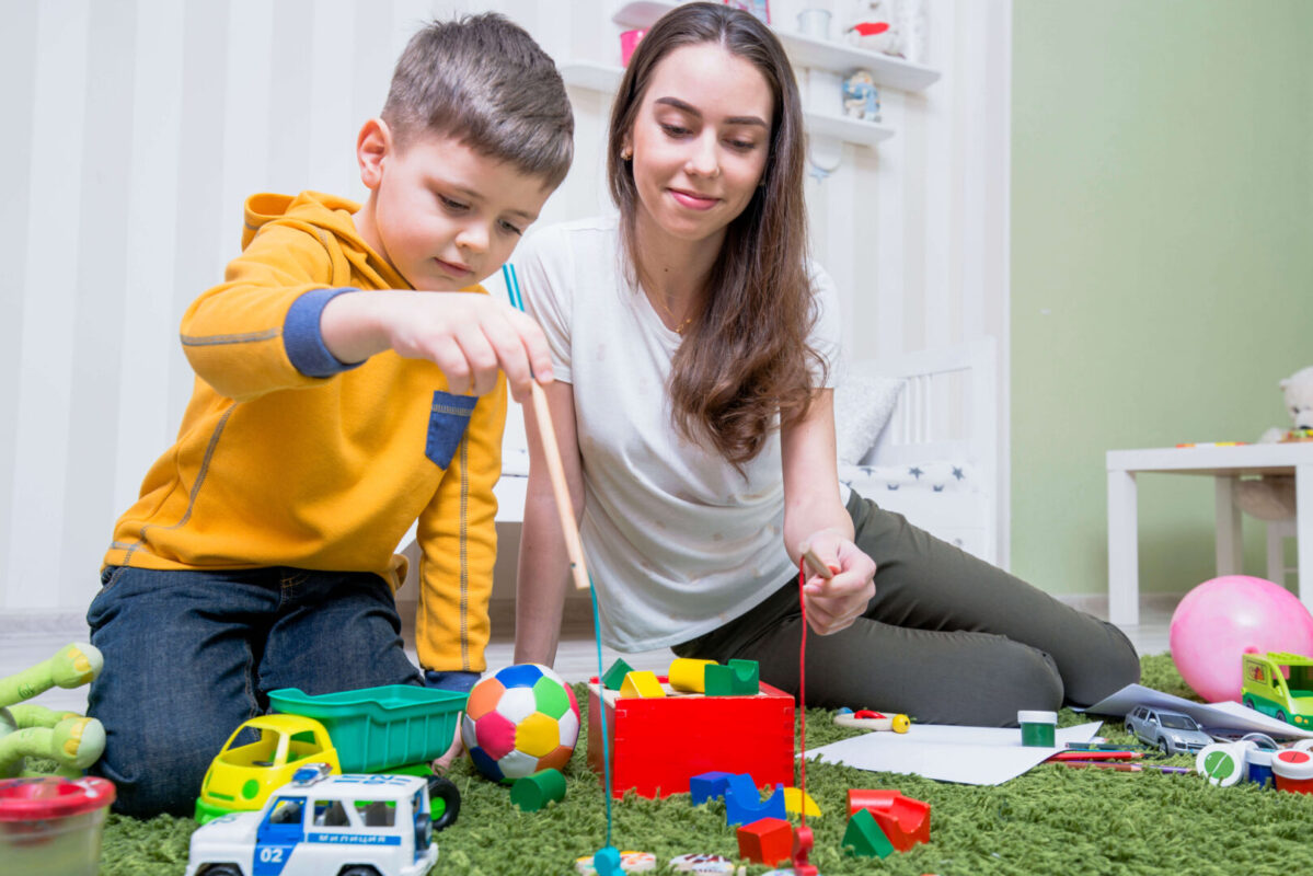 young mother playing with son